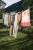 stock-photo-clothesline-laundry-fresh-clean-clothes-pins-clothes-line-laundry-drying-hanging-c...jpg